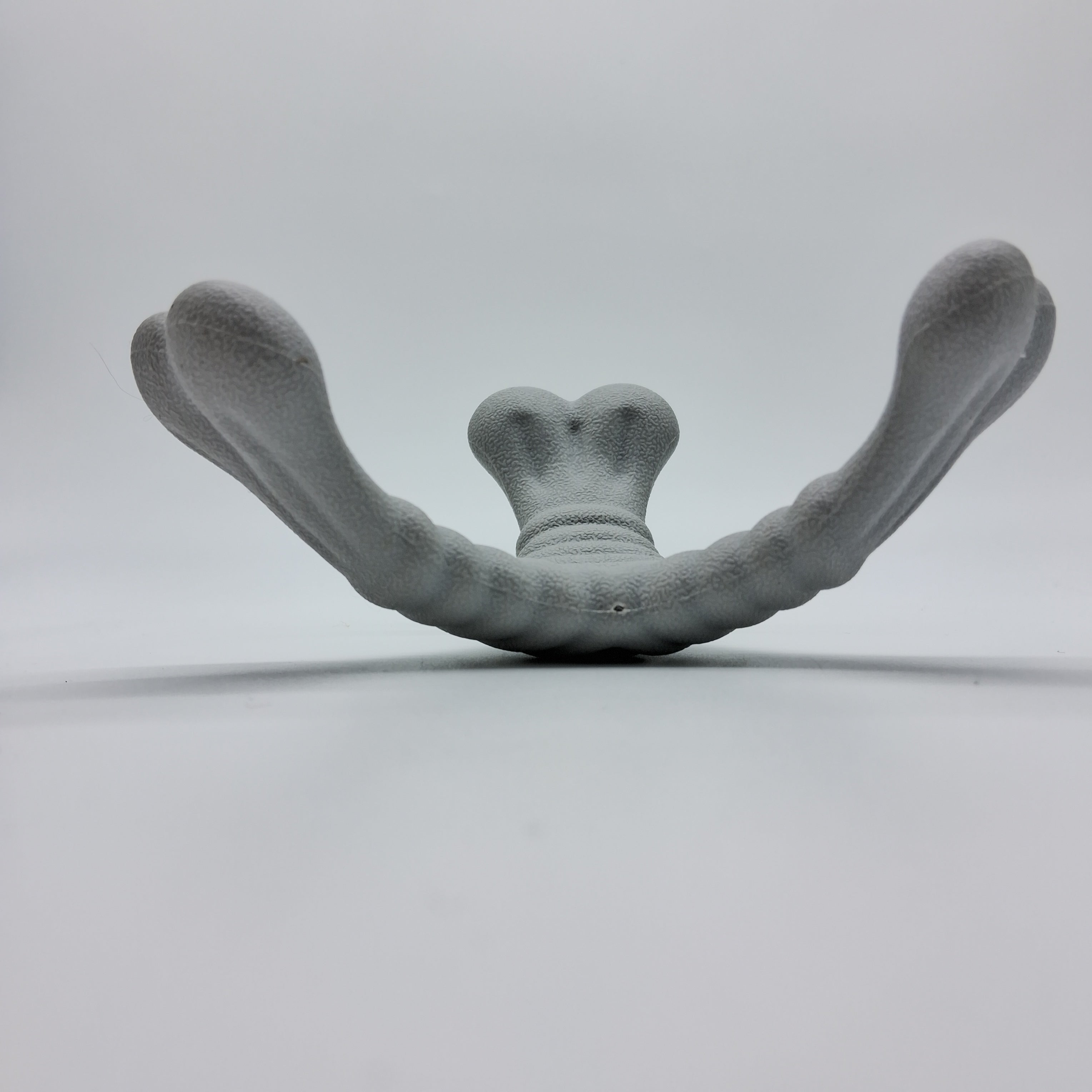 Tri-Bone XL pet toy from Toys N Treats Box featuring durable rubber material and multiple chew surfaces for dogs.
