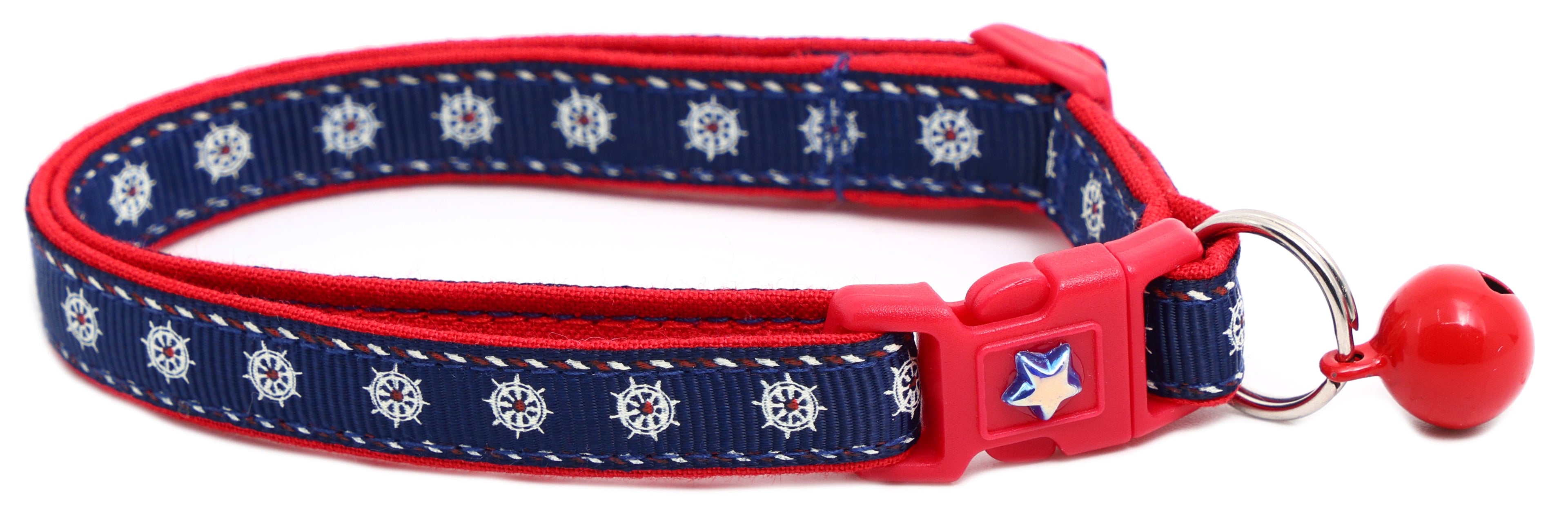 Nautical-themed Ships Wheels Breakaway Cat Collar by Pugs2Persians with a nautical wheel design and adjustable breakaway clasp.