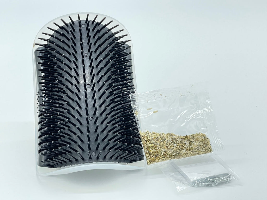 Self-grooming corner tool from Toys N Treats Box, designed for pet grooming, showing a compact grooming accessory with textured surface.