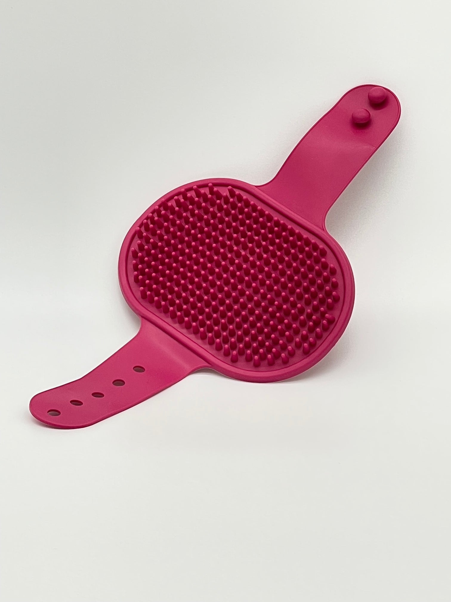 Pet grooming brush from Toys N Treats Box, a massage and shampoo tool with soft bristles for effective pet grooming.