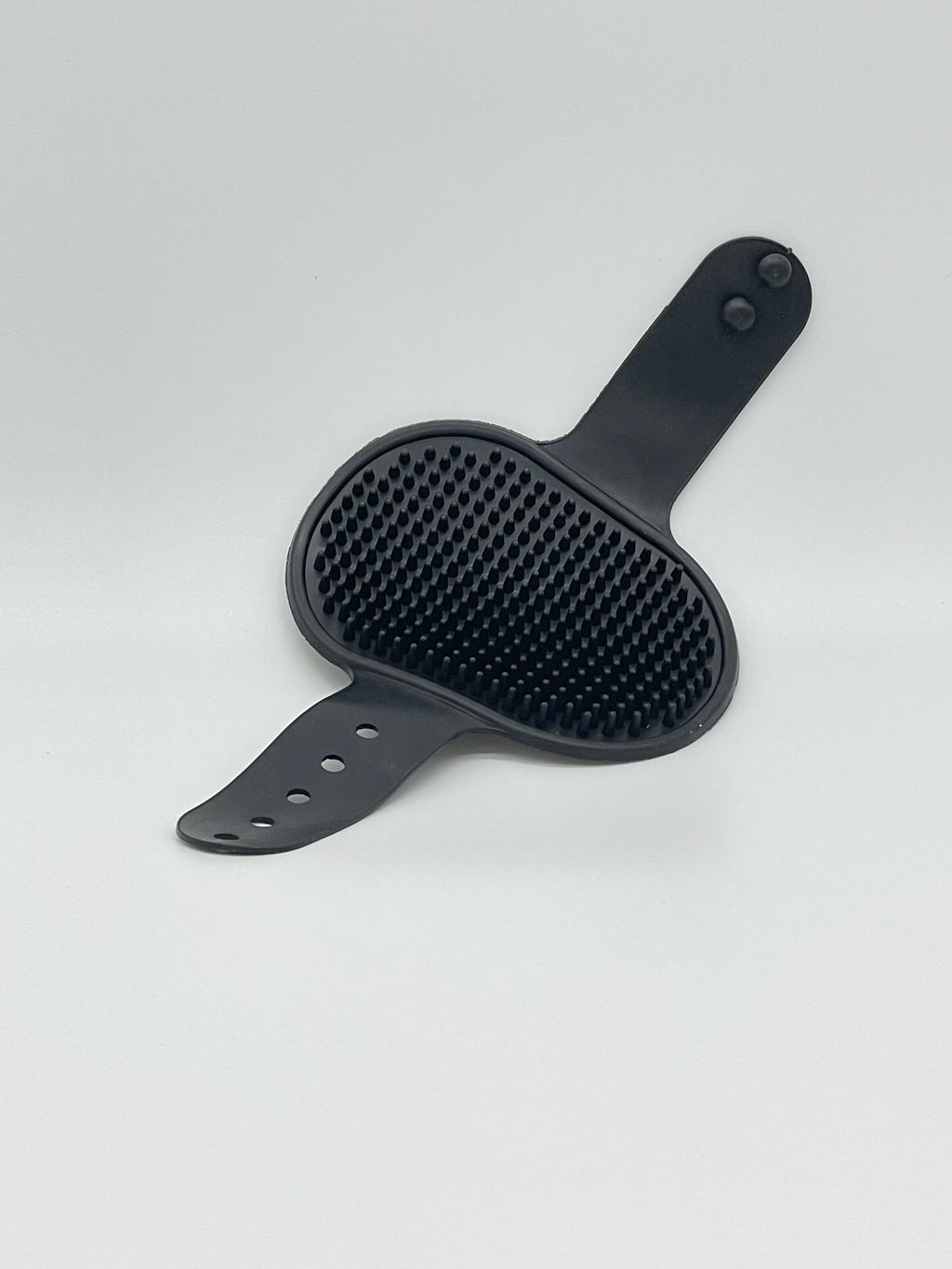 Pet grooming brush from Toys N Treats Box, a massage and shampoo tool with soft bristles for pet care and detangling.