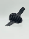 Pet grooming brush from Toys N Treats Box, a massage and shampoo tool with soft bristles for pet care and detangling.