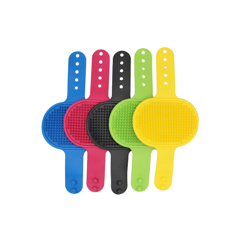 Pet grooming brush from Toys N Treats Box, a massage and shampoo tool for dogs and cats, with bristles and ergonomic handle.