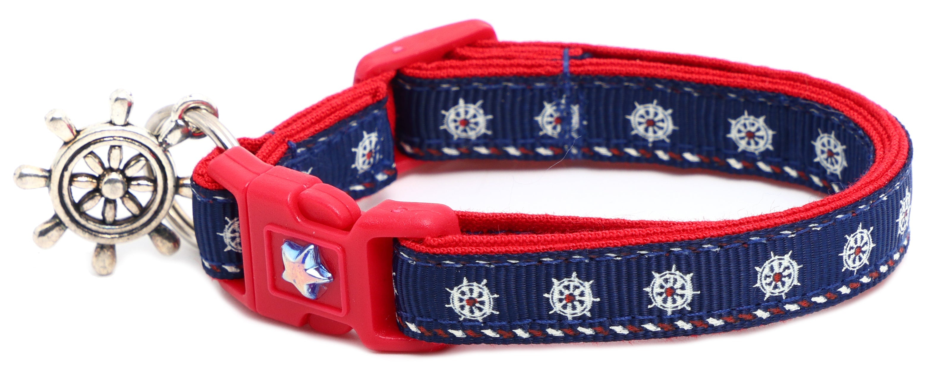 Nautical-themed Ships Wheels Breakaway Cat Collar by Pugs2Persians on a playful kitten. Durable, safe, and stylish feline accessory.