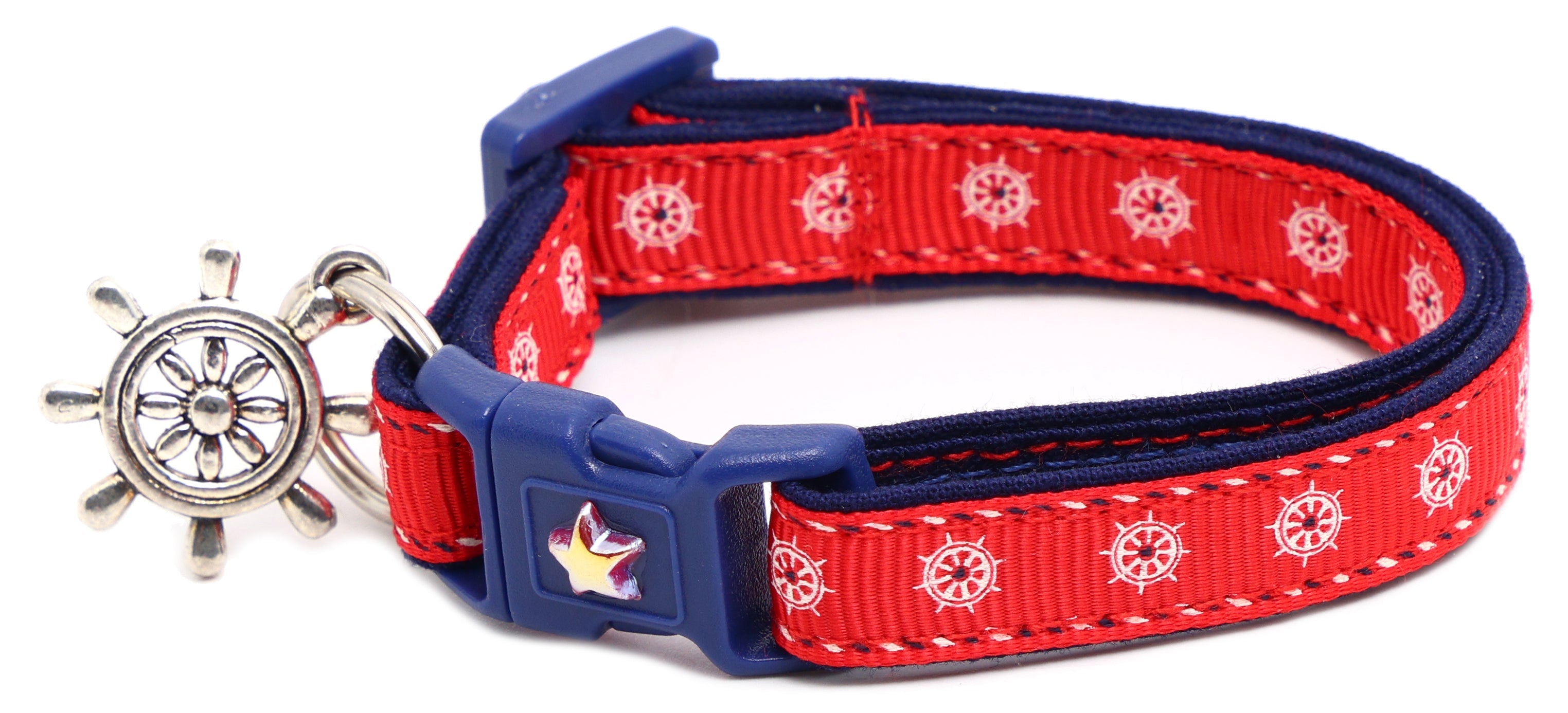 Nautical-themed Ships Wheels Breakaway Cat Collar from Pugs2Persians on a cute kitten, featuring a breakaway safety buckle.