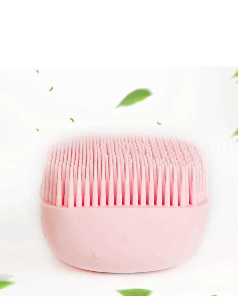 Silicone pet bath brush from Pet Essentials Hub with massage bristles and built-in shampoo dispenser for dogs and cats.