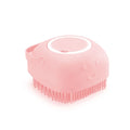 Silicone pet bath brush from Pet Essentials Hub with massage bristles and built-in shampoo dispenser for dogs and cats.