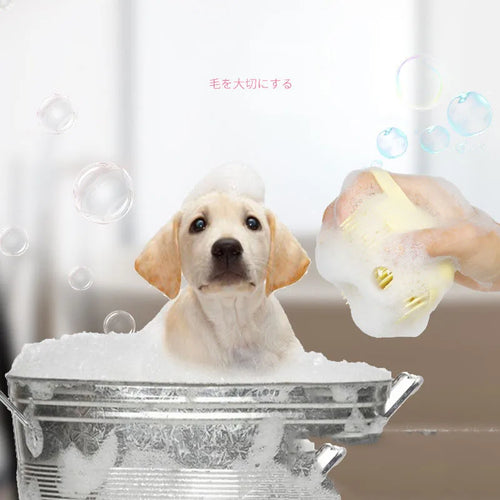 Silicone pet bath brush with massage and shampoo dispenser for dogs and cats, featuring soft bristles and ergonomic design.