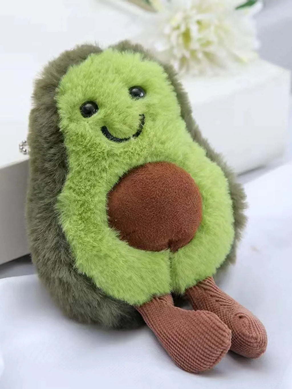 Cute pet plush toy shaped like an avocado, designed for cats, from Pet Essentials Hub, soft and entertaining cat toy.