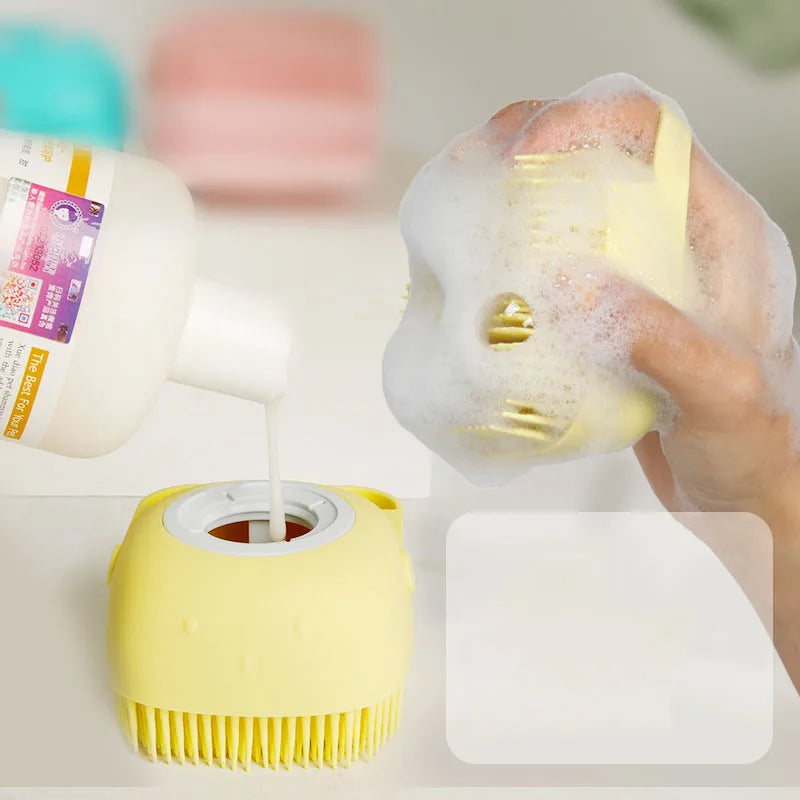 Silicone pet grooming brush with massage and shampoo dispenser for dogs and cats, designed for easy bathing and grooming.